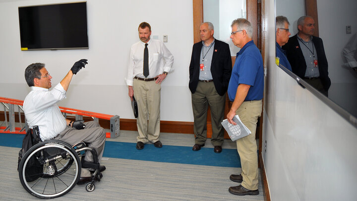 Lance Pérez (from left) talks with UNL's Chad Lea, Mark Miller and Dale Bowder in the virtual life sciencs lab on the second floor of Brace Laboratory on Aug. 18.  The building reopens Aug. 25 after an $8 million renovation.