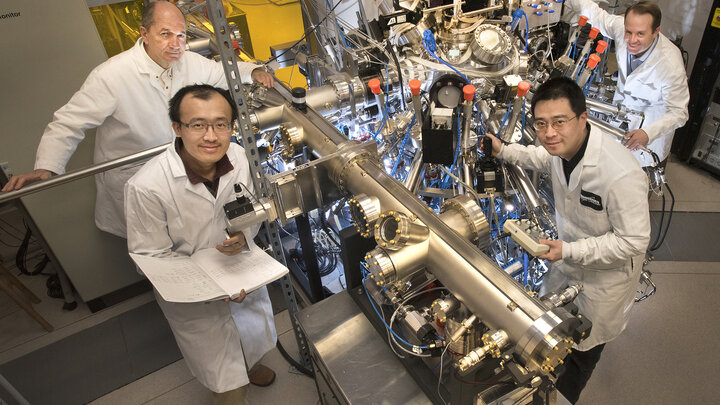 Xi He and team with research equipment